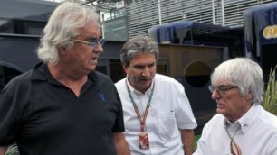 Flavio Briatore e Bernie Ecclestone nel paddock di Monza durante il Gp 2014, insieme al braccio destro di Ecclestone, Pasquale Lattuneddu