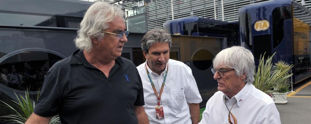 Flavio Briatore e Bernie Ecclestone nel paddock di Monza durante il Gp 2014, insieme al braccio destro di Ecclestone, Pasquale Lattuneddu