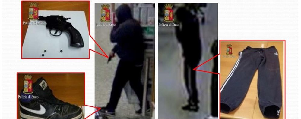 Uno dei  rapinatori inquadrato dalle telecamere del supermercato