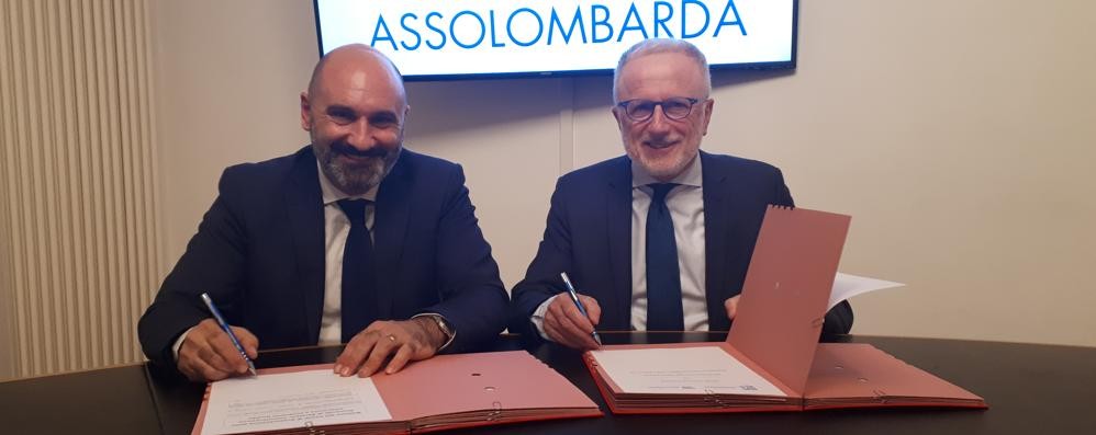 Monza, firma protocollo Assolombarda Inps: Francesco De Luca, direttore sede INPS Monza, e Alessandro Scarabelli, direttore generale di Assolombarda