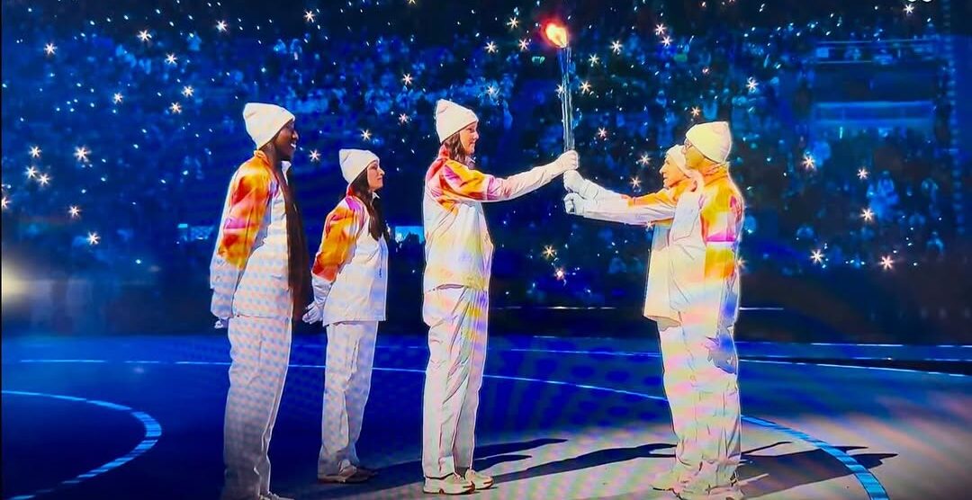 Il passaggio della fiamma olimpica a San Siro nello screenshot di Vero Volley