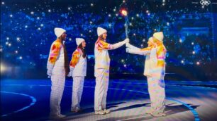 Il passaggio della fiamma olimpica a San Siro nello screenshot di Vero Volley